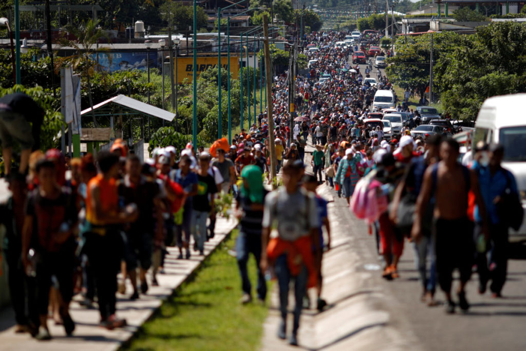 Central American migrants walk along the highway near the border with Guatemala, as they continue their journey trying to reach the U.S., in Tapachula, Mexico October 21, 2018. REUTERS/Ueslei Marcelino TPX IMAGES OF THE DAY - RC1A8C0D9D30